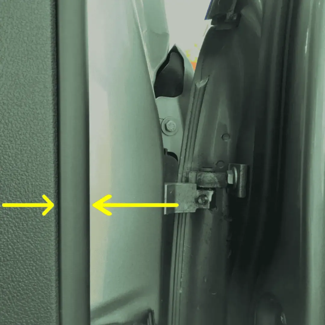 Checking car door rubber seals for oversprayed paint from a repair